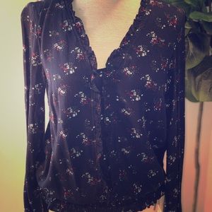Long sleeved ruffled blouse. New with tags.